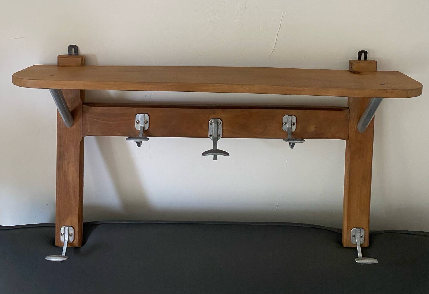 Wall-mounted coat rack with vintage hooks