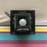 Old black forged iron suspension vintage in moulded glass