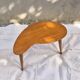 Vintage Scandinavian bean side table with wooden tapered legs.
