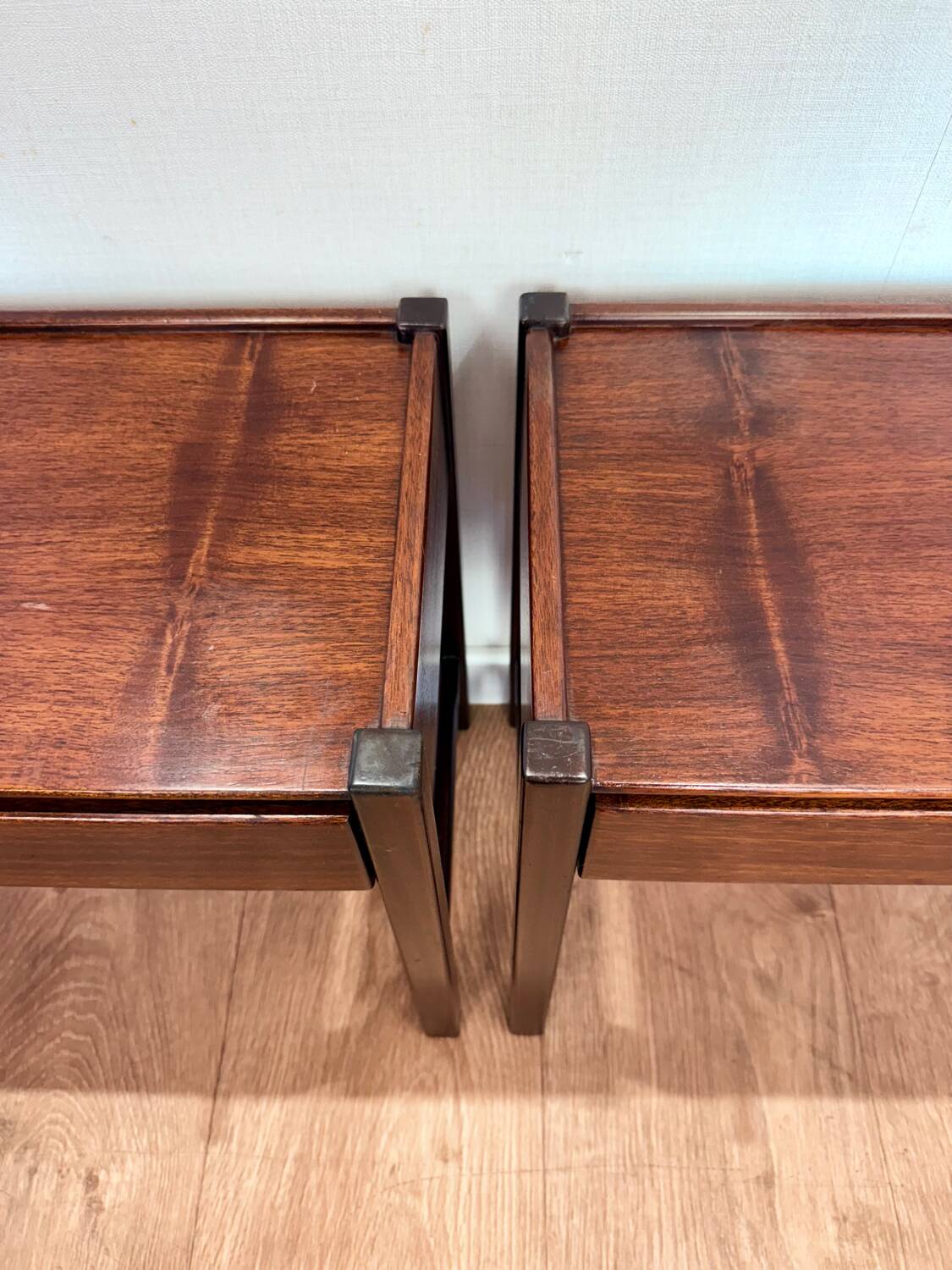 Pair of walnut bedside tables designed by Jacques Hauville for Roche Bobois.