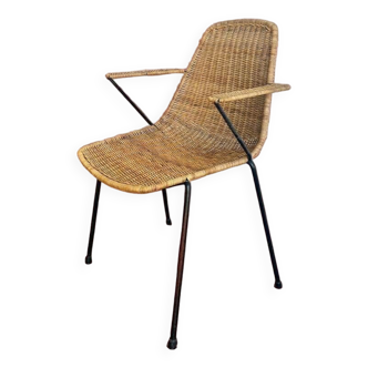 Vintage wicker chair with black steel frame and armrests