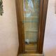Walnut showcase, grooved uprights, 4 glass shelves