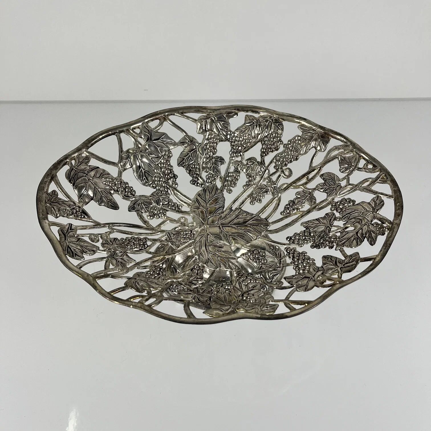 Openwork metal bowl with vine leaf and grape motif, 20th century