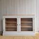 Beige glass and wood sideboard