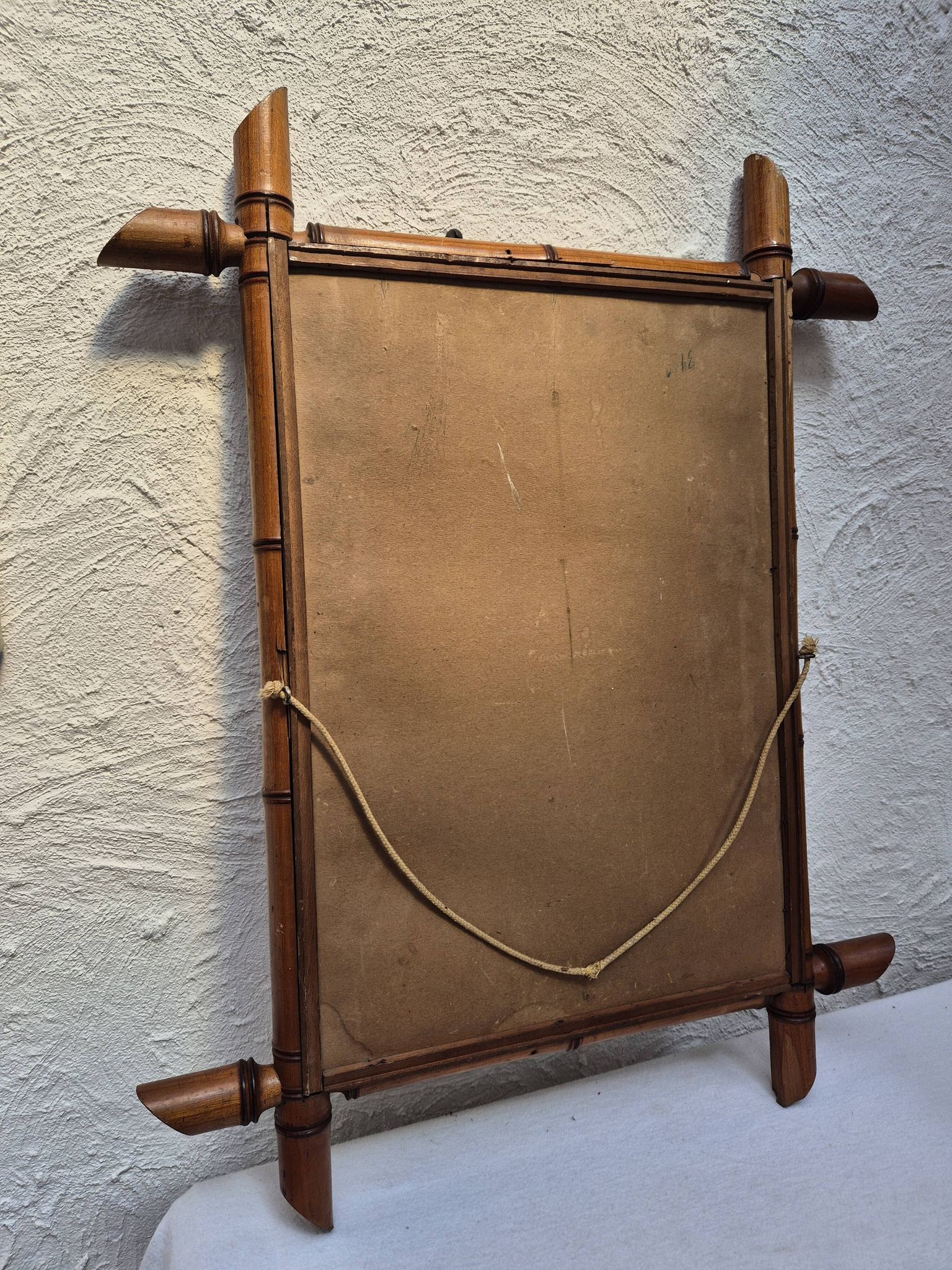 Vintage wooden mirror imitating bamboo
