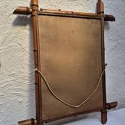 Vintage wooden mirror imitating bamboo