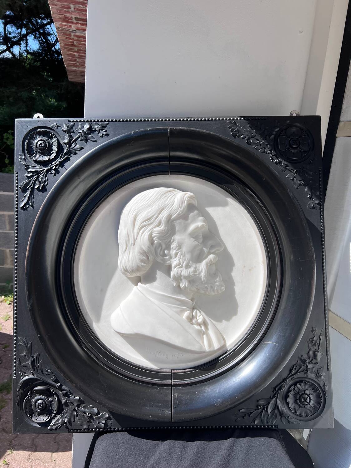 Bas-relief in marble and carved ebony signed Jouffroy, 1873