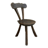 Brutalist chair in carved solid wood, around 1950.