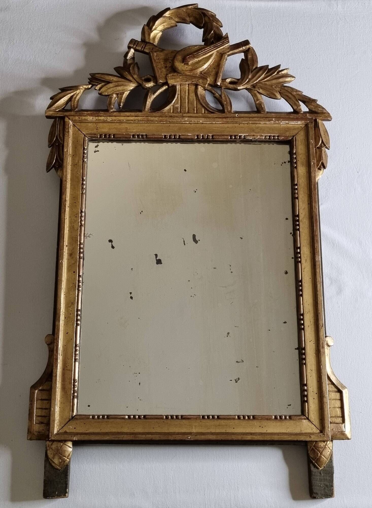 Antique carved and gilded wooden mirror, Louis XVI style – 54 x 92 cm