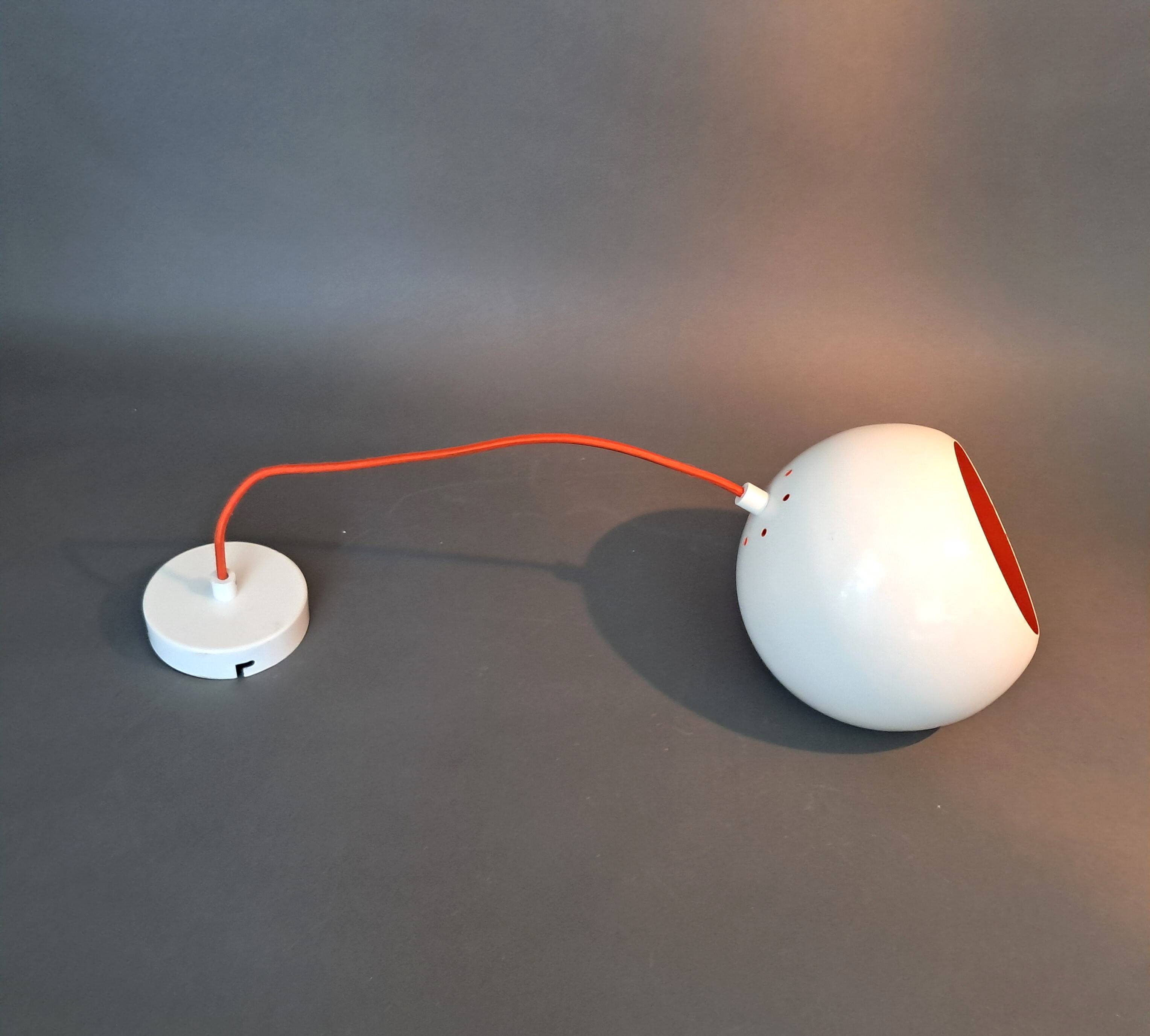 White openwork pendant light with orange interior 1970/1980.