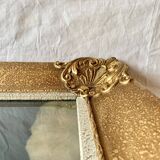 Old wall frame in carved gilded wood