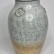 Stoneware vase signed by Sylvie Dufour, incised decoration and relief medallions, 28 cm.