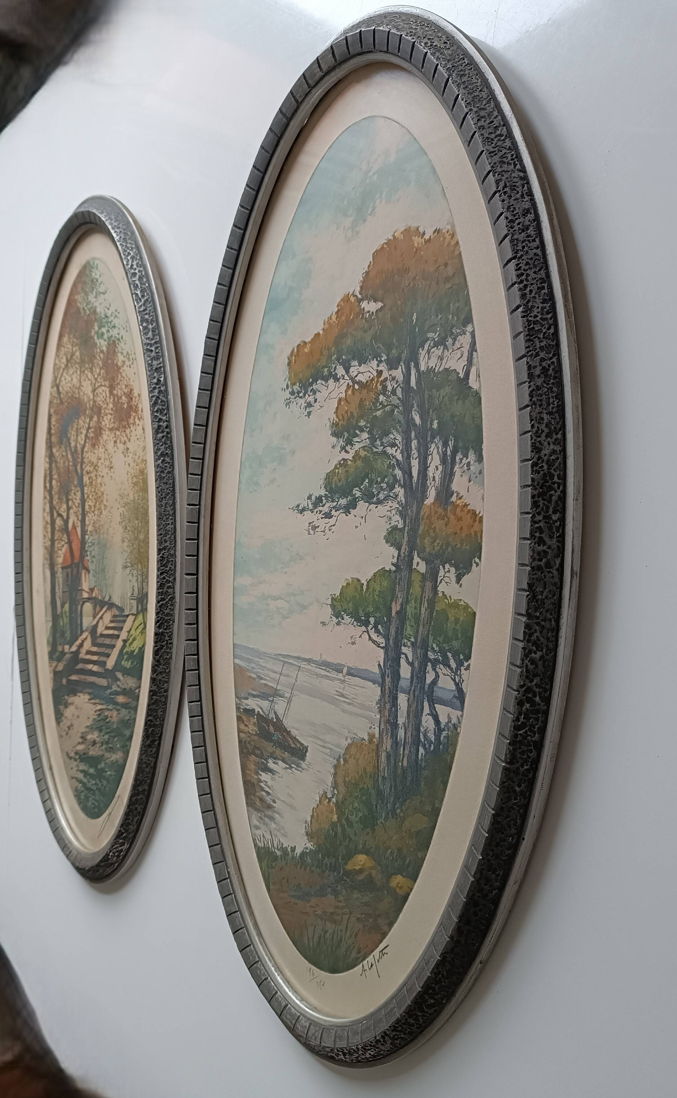 Pair of color lithographed landscape paintings