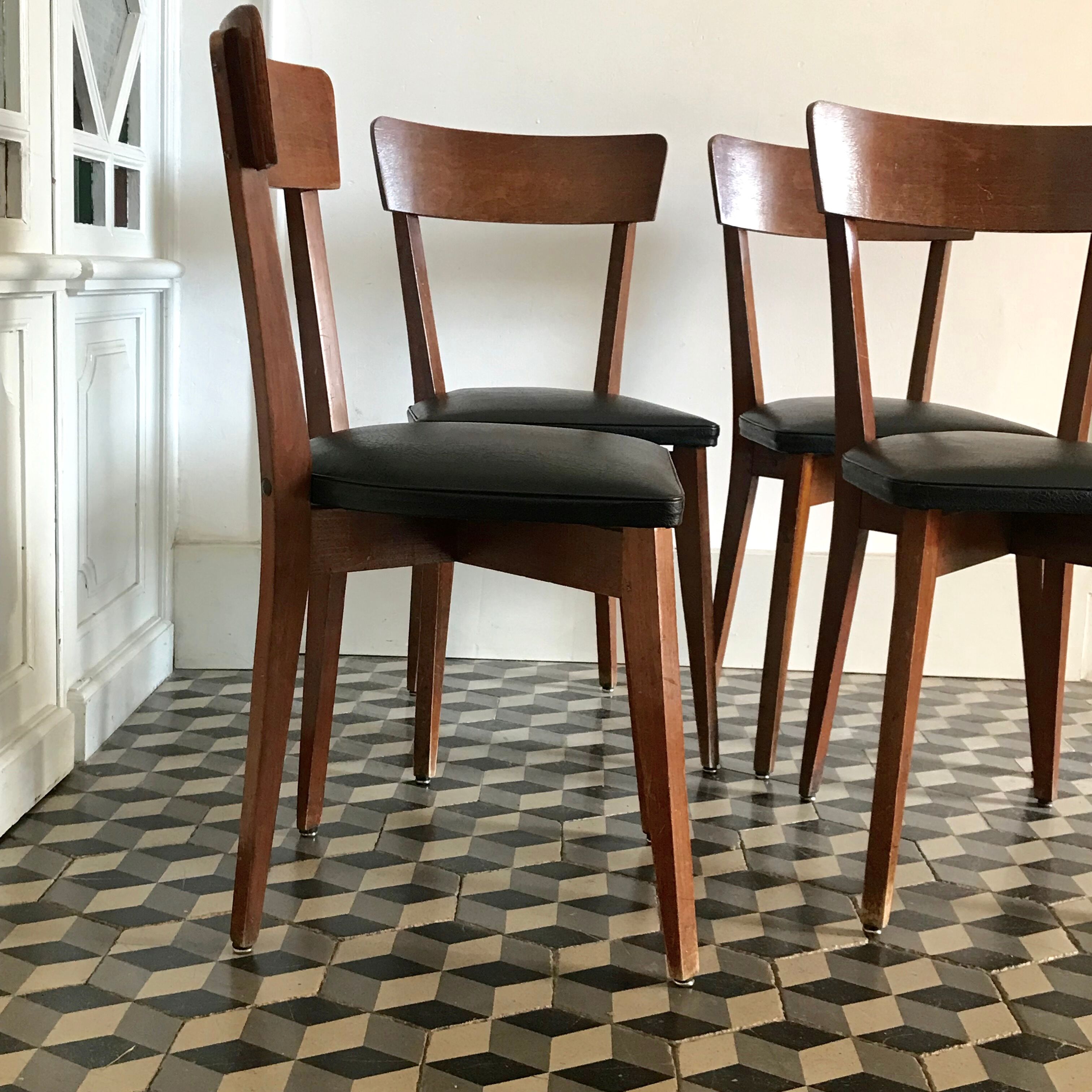 Vintage wooden and black skai chairs