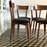Vintage wooden and black skai chairs