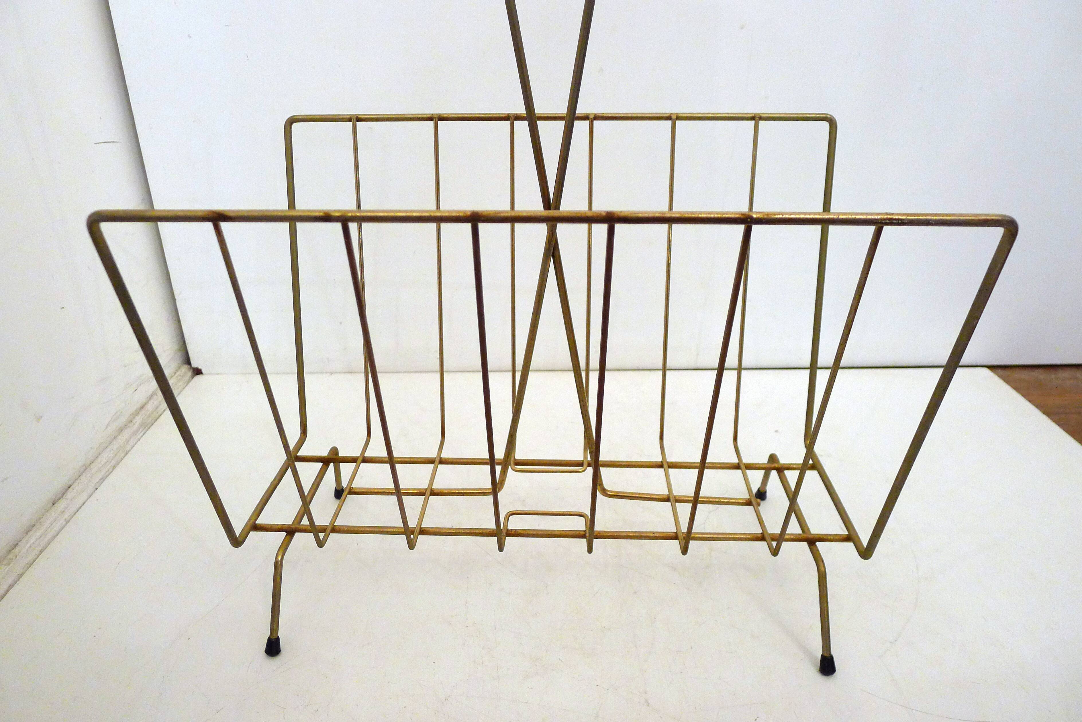 Mid-century openwork magazine rack, in gold metal & wooden handle.