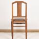 Chaise style Art Déco en bois sculpté et cuir.