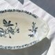 Iron flat plate with a 19th-century bird signed Onnaing "Poppies"