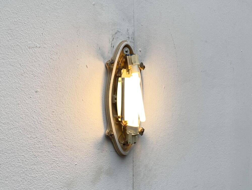 Postmodern Italian wall lamp for indoor and outdoor use, Geco 1 by Luciano Pagani and Angelo Perversi for Arteluce, 1990s.