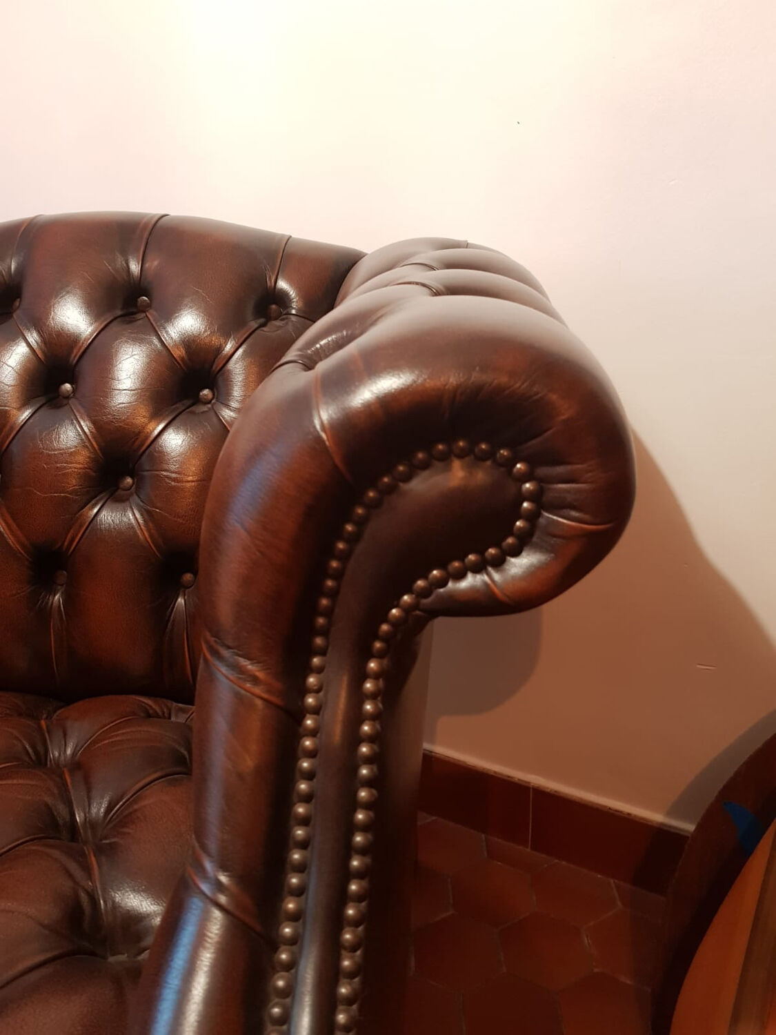 Pair of leather Chesterfield armchairs