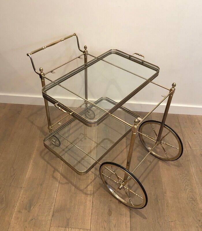 Neoclassical style rolling table in silvered brass