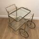 Neoclassical style rolling table in silvered brass