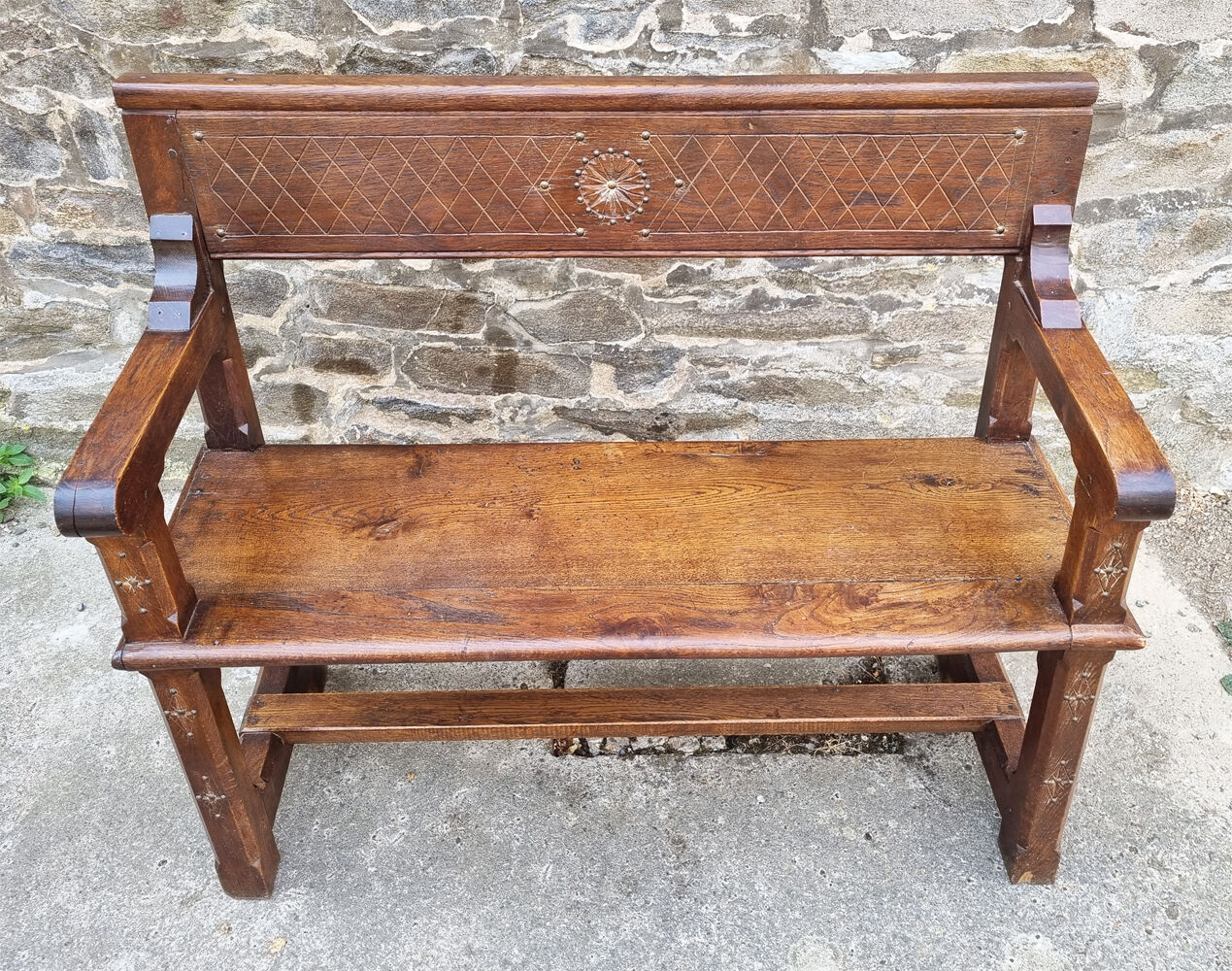 Stylized church pew, early twentieth century, solid wood