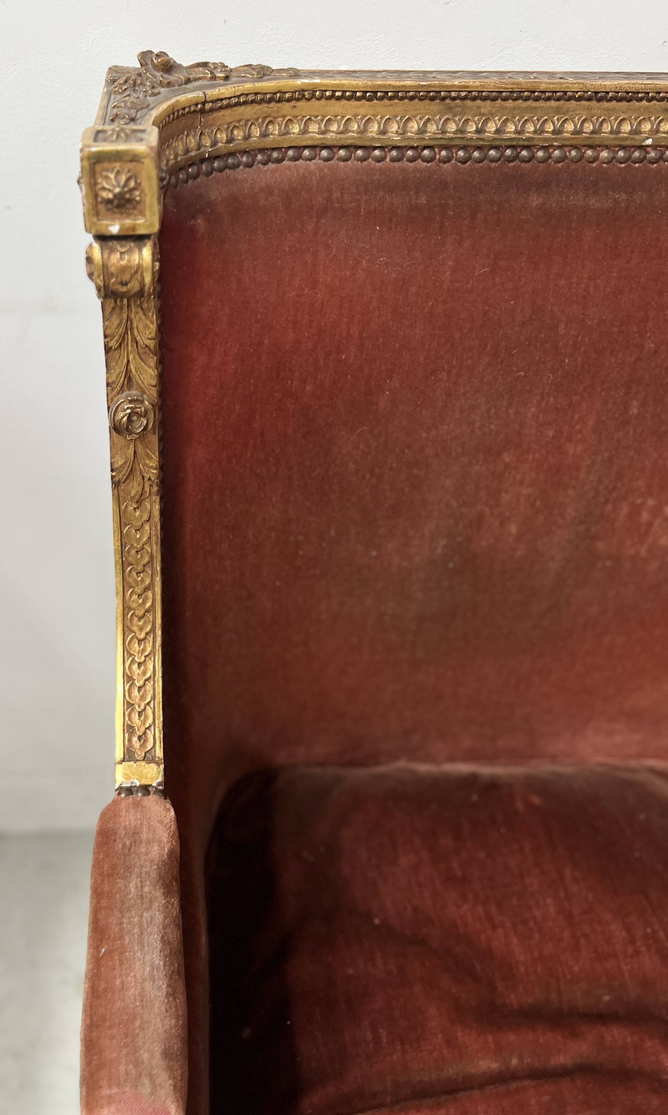 Two Louis XVI style wing chairs in gilded wood, 20th century