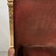 Two Louis XVI style wing chairs in gilded wood, 20th century