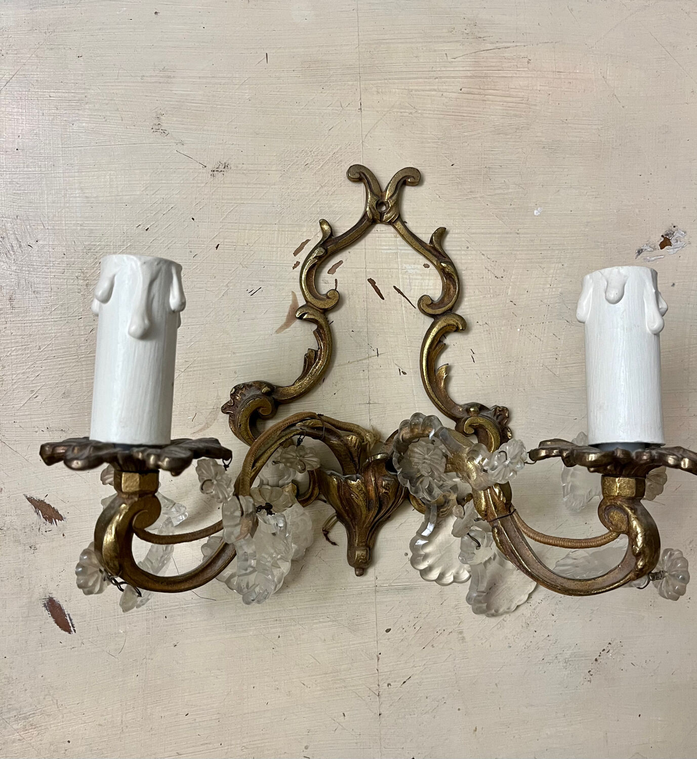 Louis XV style two-light bronze wall light with antique tassels