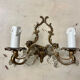 Louis XV style two-light bronze wall light with antique tassels