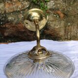 Holophane glass and brass wall light