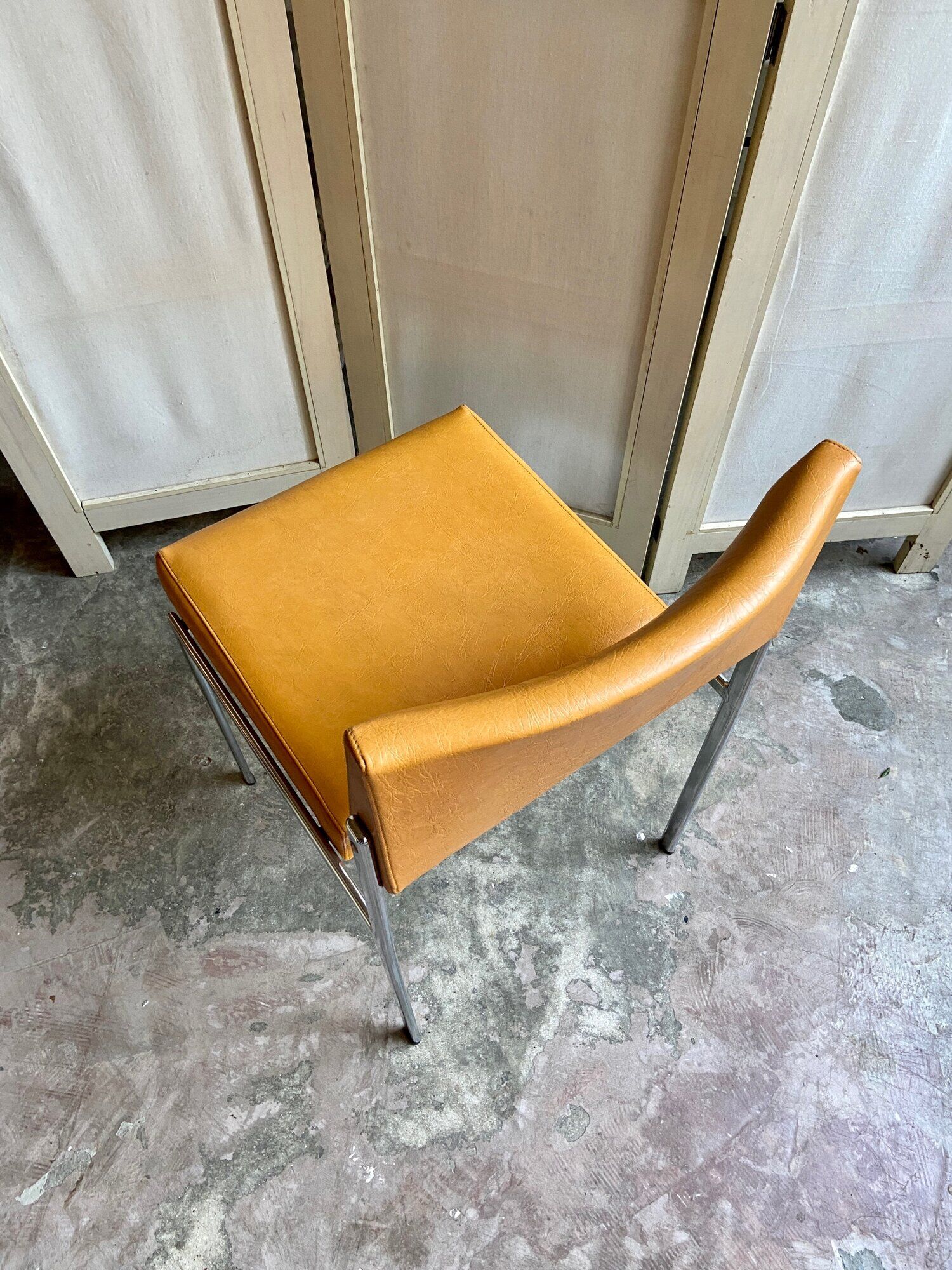 Chair in chromed metal and ochre skaï 1970s