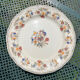 Composition of 4 flat earthenware plates, Gien