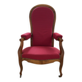 Antique Louis Philippe armchair in walnut and red fabric.