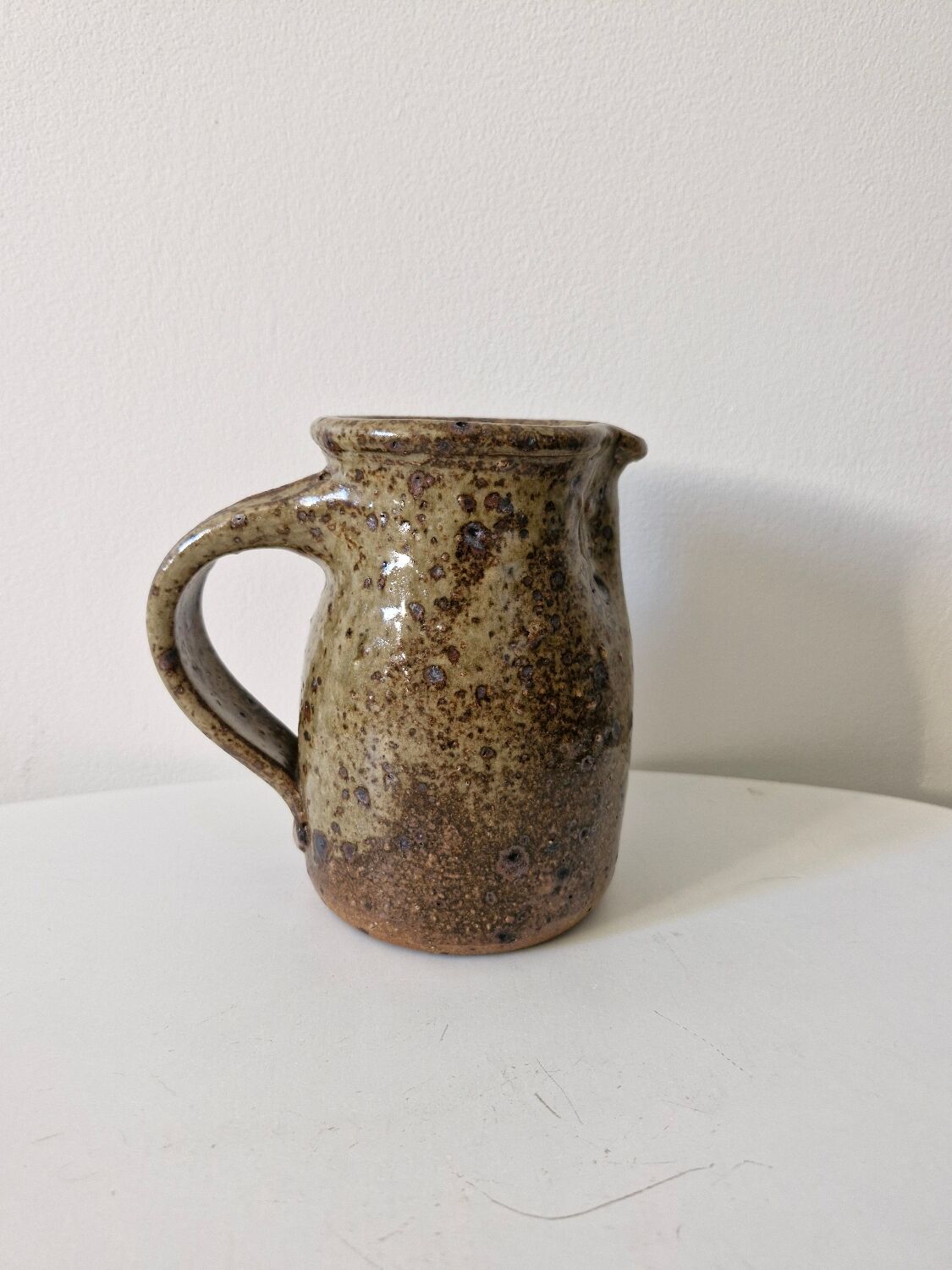 Old pitcher in pyrite stoneware