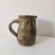 Old pitcher in pyrite stoneware
