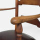 Antique rustic armchair in walnut and leather, 18th century.