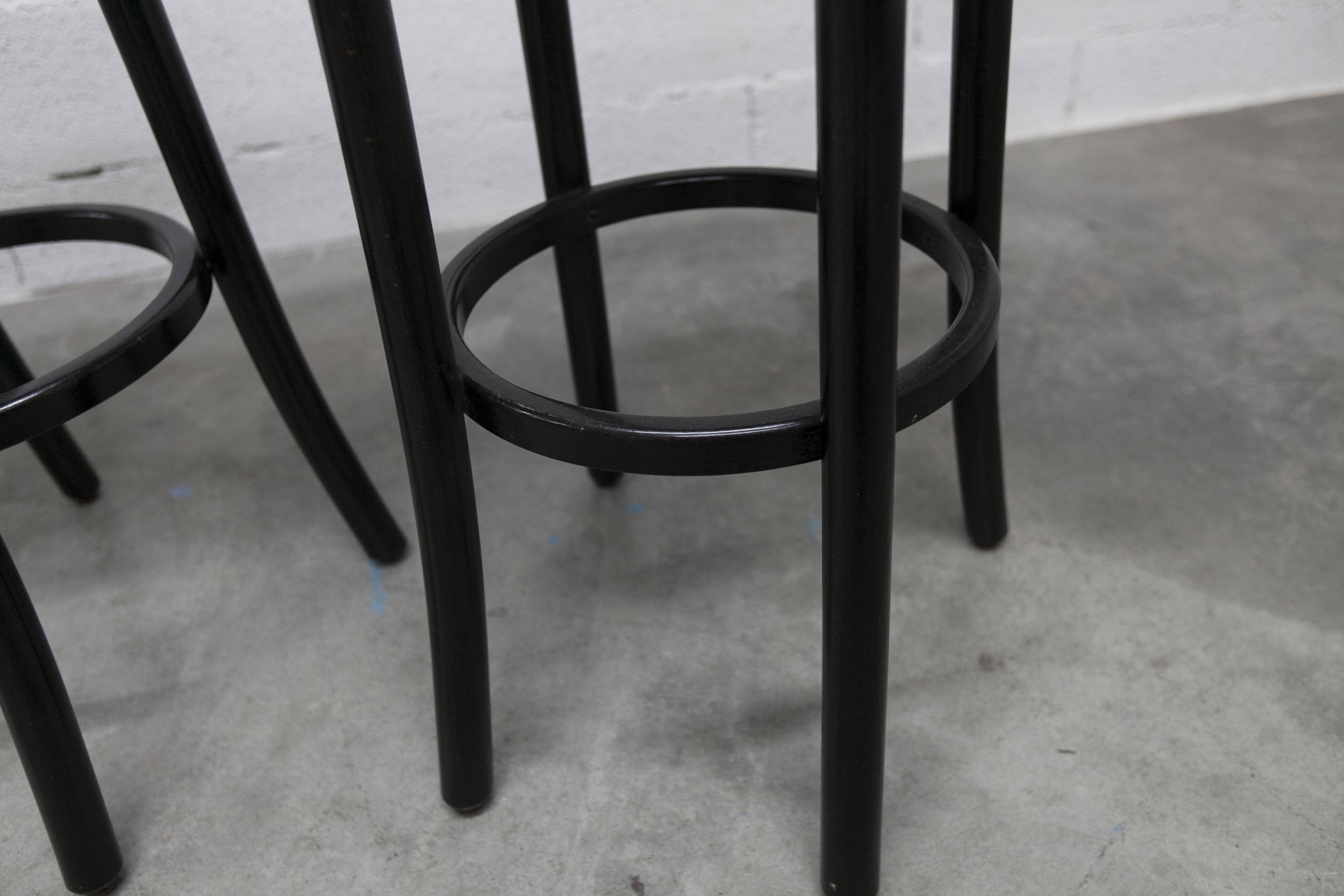 Pair of Baumann Dialog model stools in black and yellow and blue imitation leather, 1990