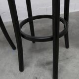 Pair of Baumann Dialog model stools in black and yellow and blue imitation leather, 1990