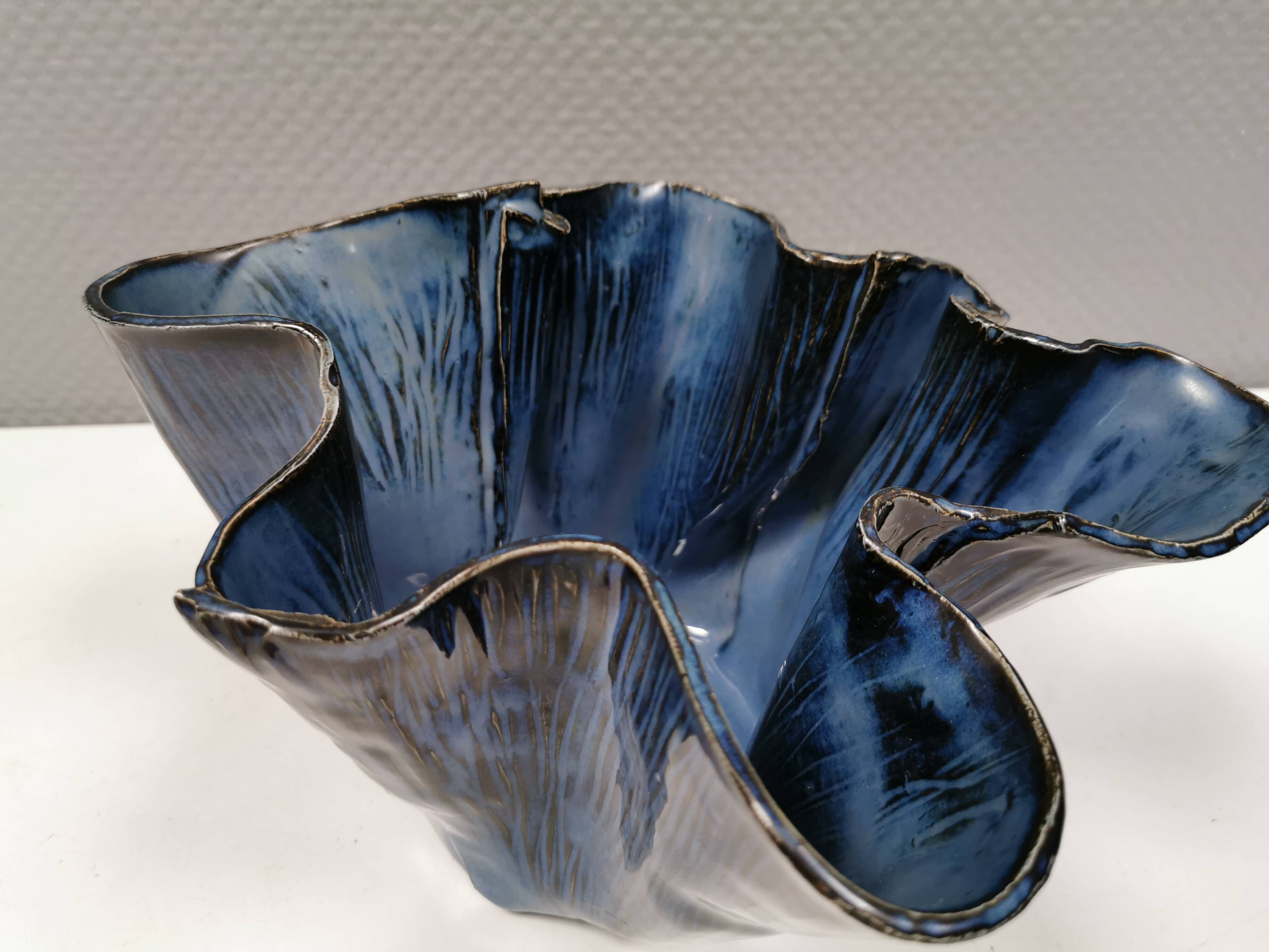 Very special vase in “folded” bluish glazed clay.