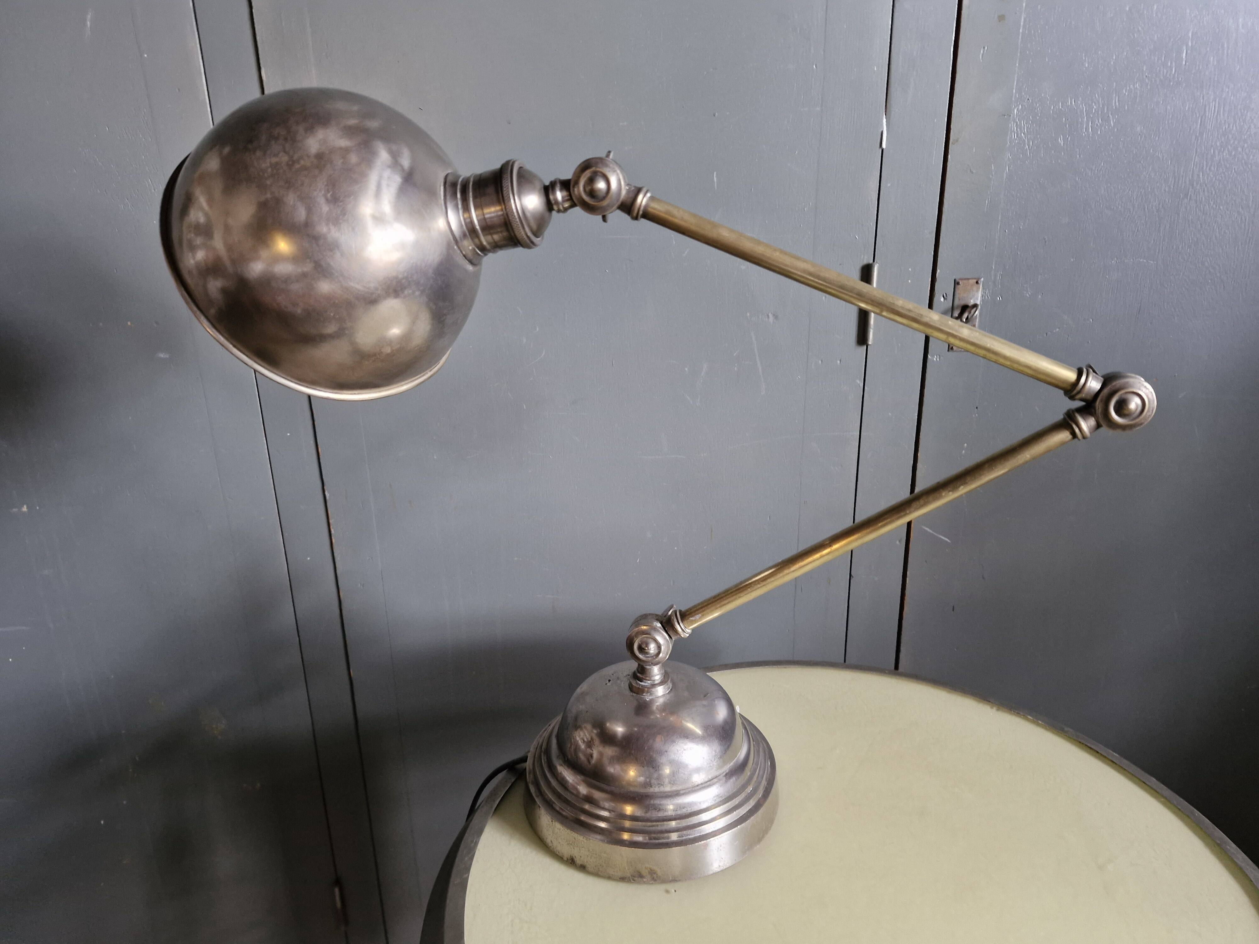 Old adjustable industrial lamp in bronze with 2 arms.