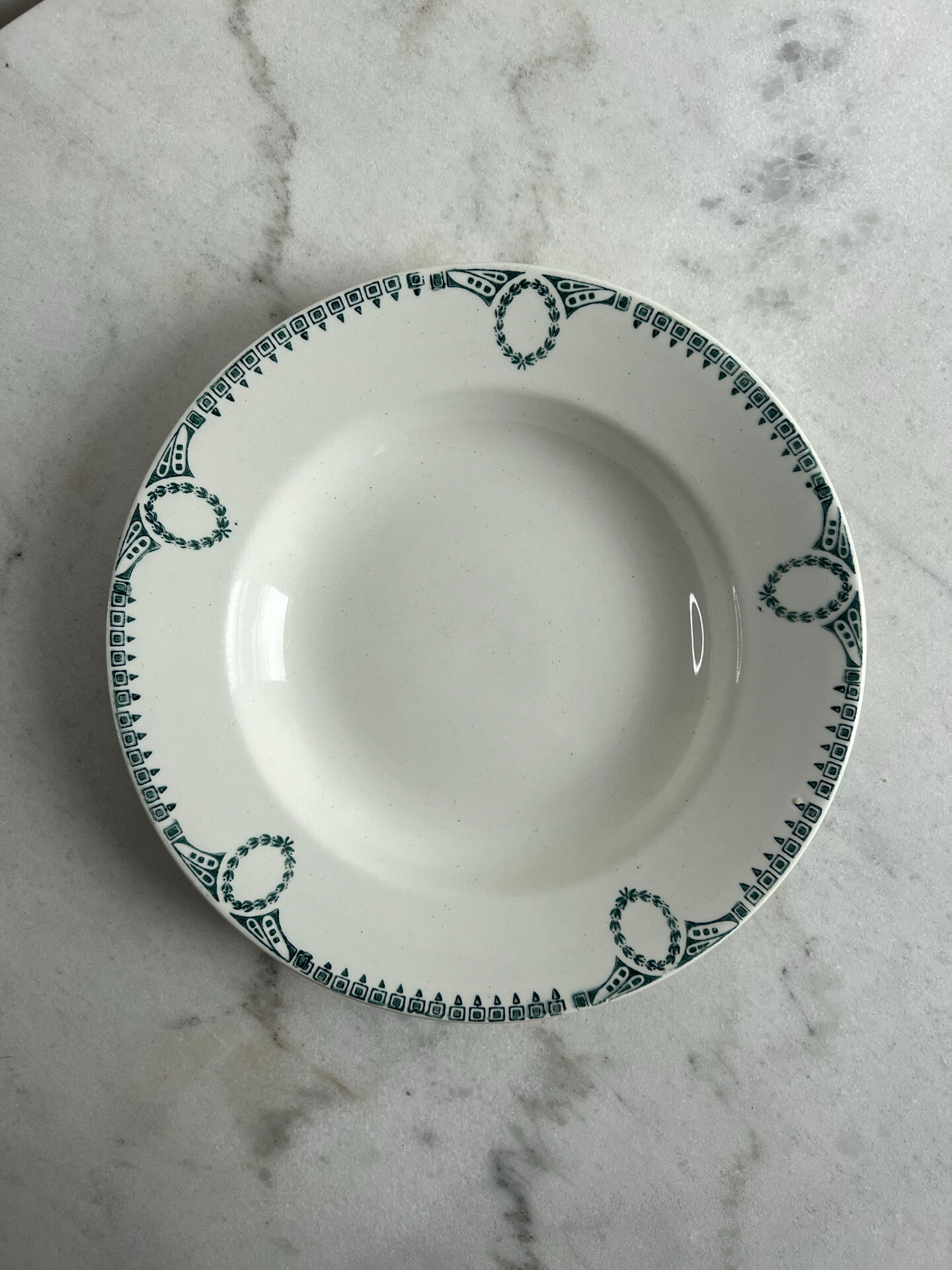 Céranord Saint Amand deep plate with green crown decoration.