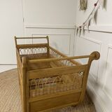 Wooden and rattan baby bed