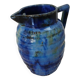 Antique pitcher in enamelled ceramic