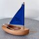Small navigable pond sailboat made of wood and cotton, in good condition.