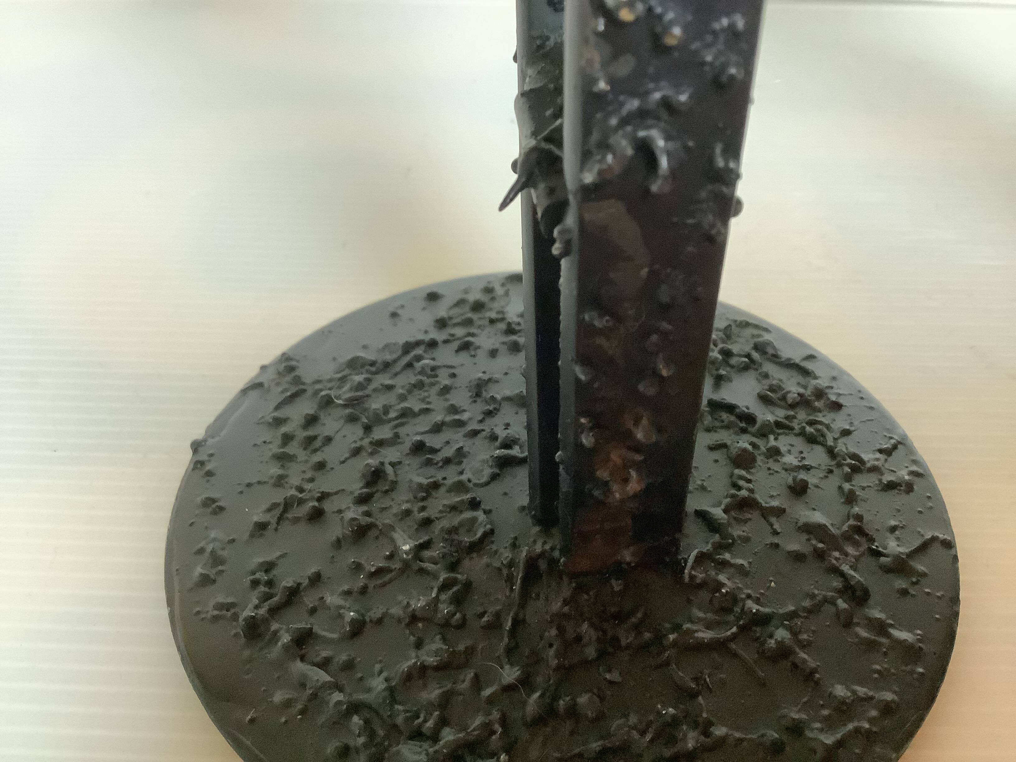 Pair of black metal candlesticks