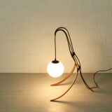 Sculptural table lamp with globe