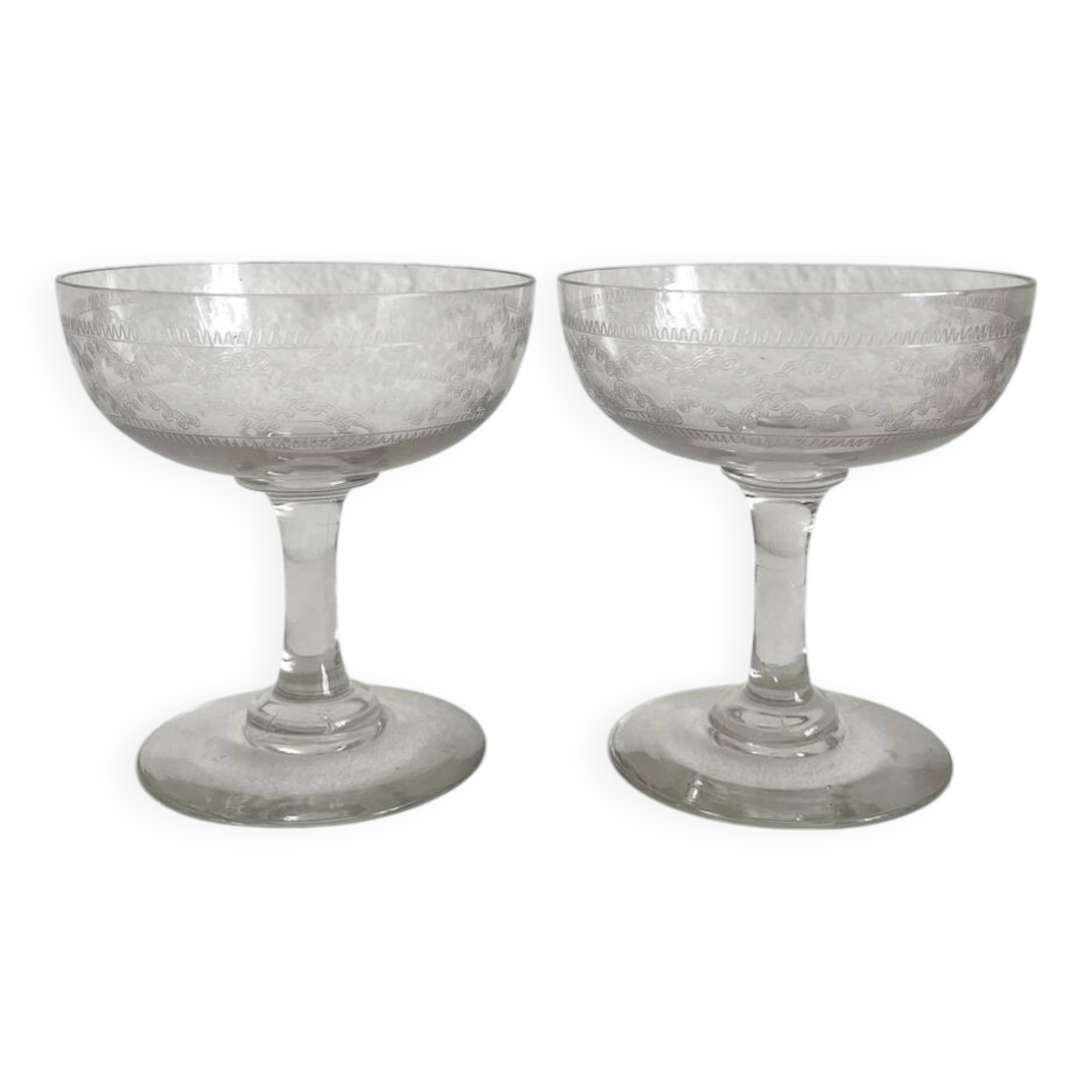 2 antique champagne glasses in engraved glass