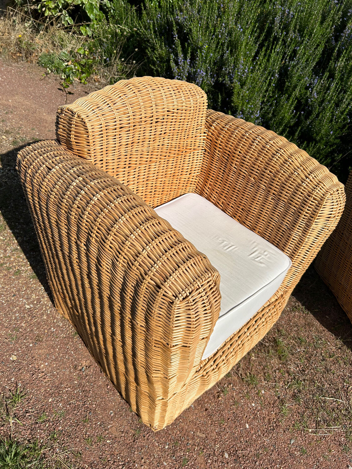 Large rattan armchairs